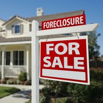 Foreclosure Real Estate Sign and House