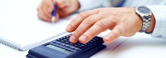 Closeup of a businessman calculating