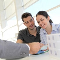 Happy young couple buying new house